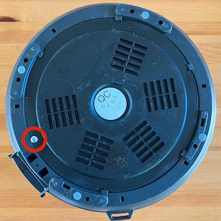 a photo of the bottom cover of an Instant Pot with the screw highlighted