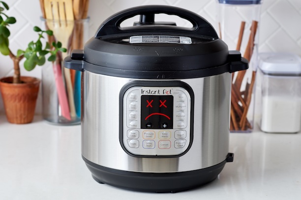 an edited photo depicting a sad Instant Pot