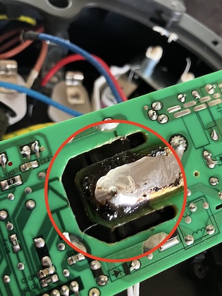 a photo of a circuit board with a repaired solder joint